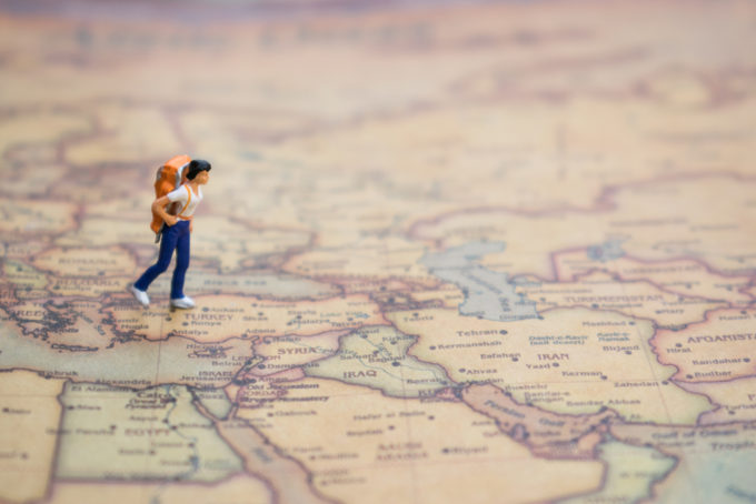 tiny woman wandering map