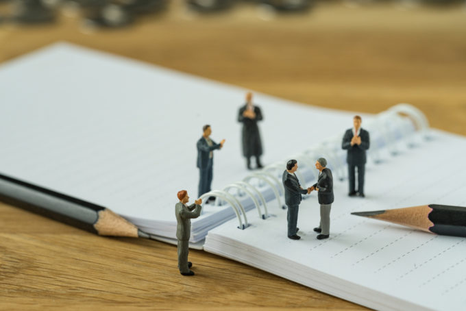 tiny people on notebook